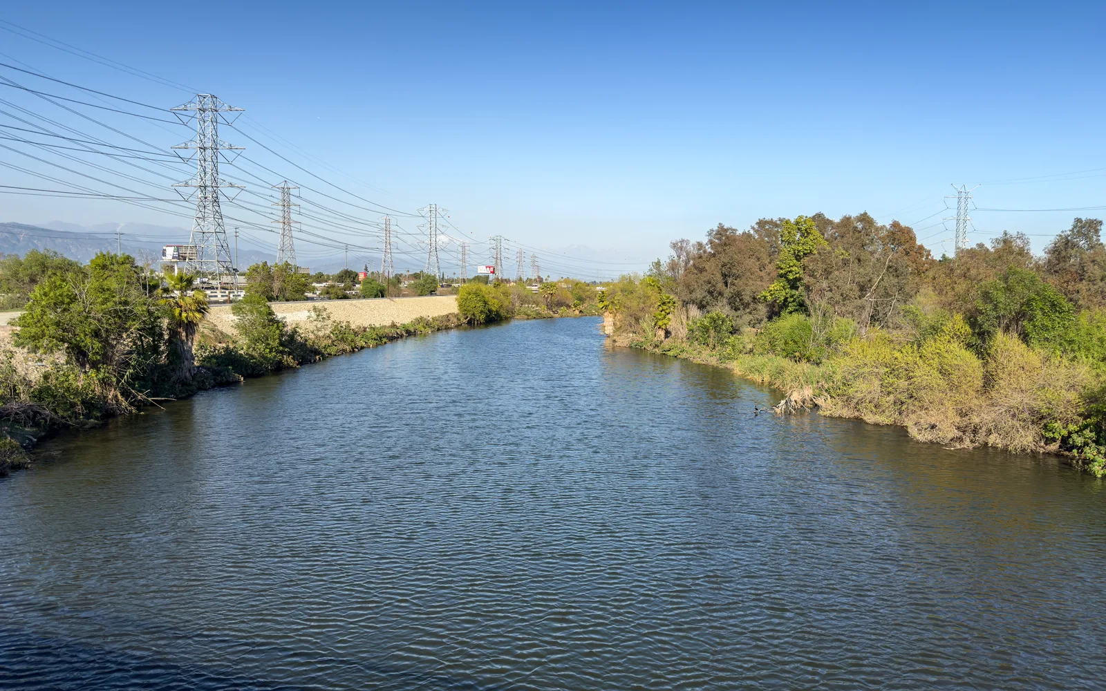 The San Gabriel River flowing beneath Peck Road Bridge between South El Monte and Industry, California